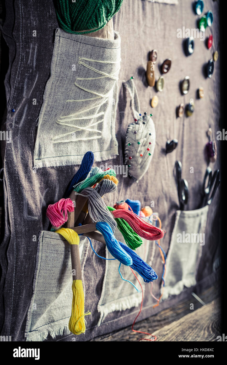 Handmade sewing mat made of threads, needles and buttons in tailor ...