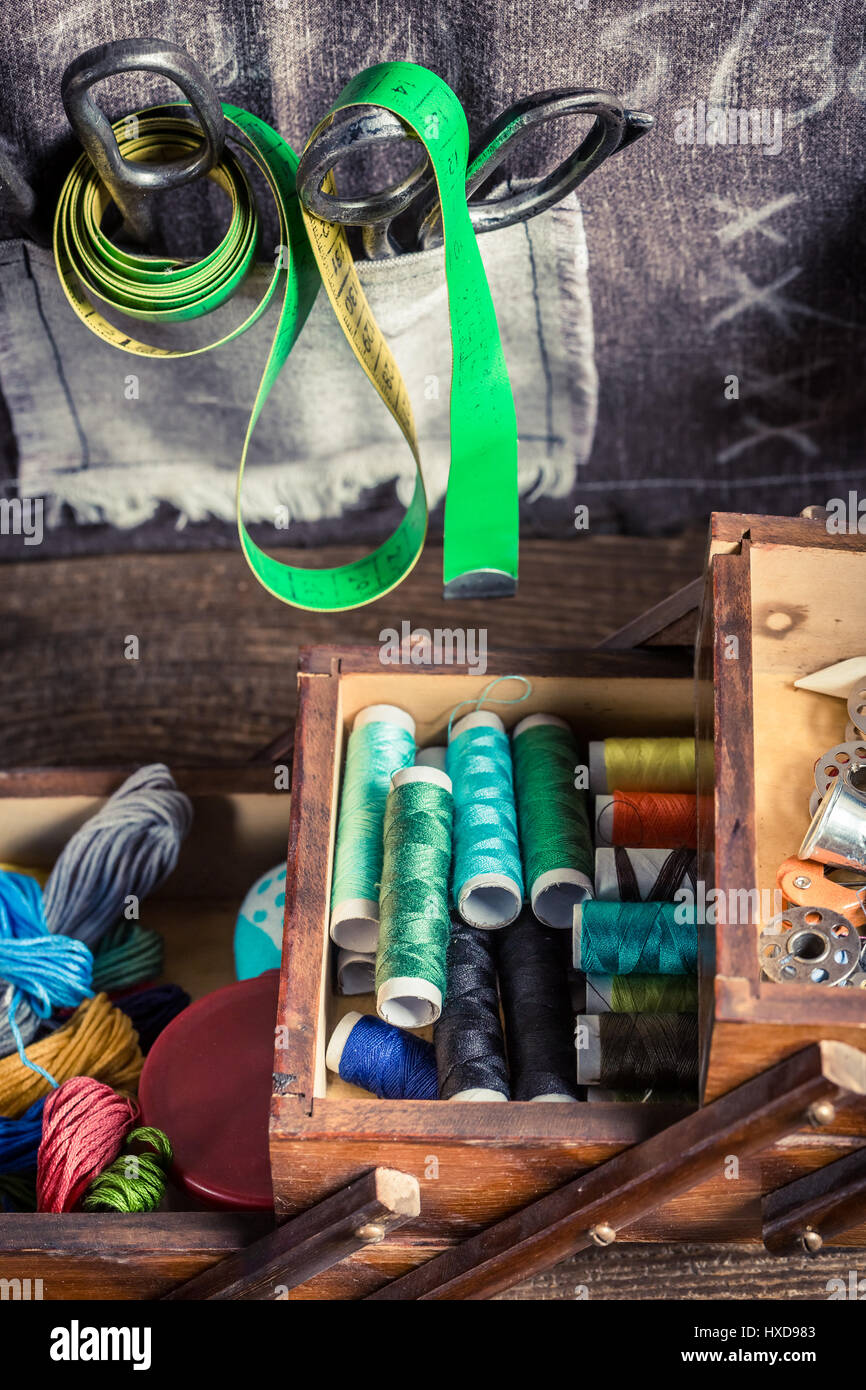 Tailor's wooden box with needles, threads and buttons Stock Photo - Alamy