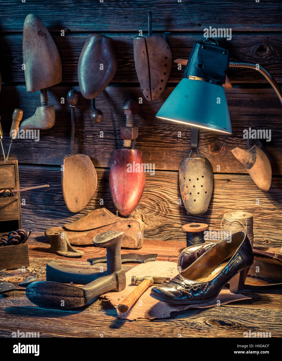 Shoemaker workshop with tools, shoes and leather Stock Photo - Alamy