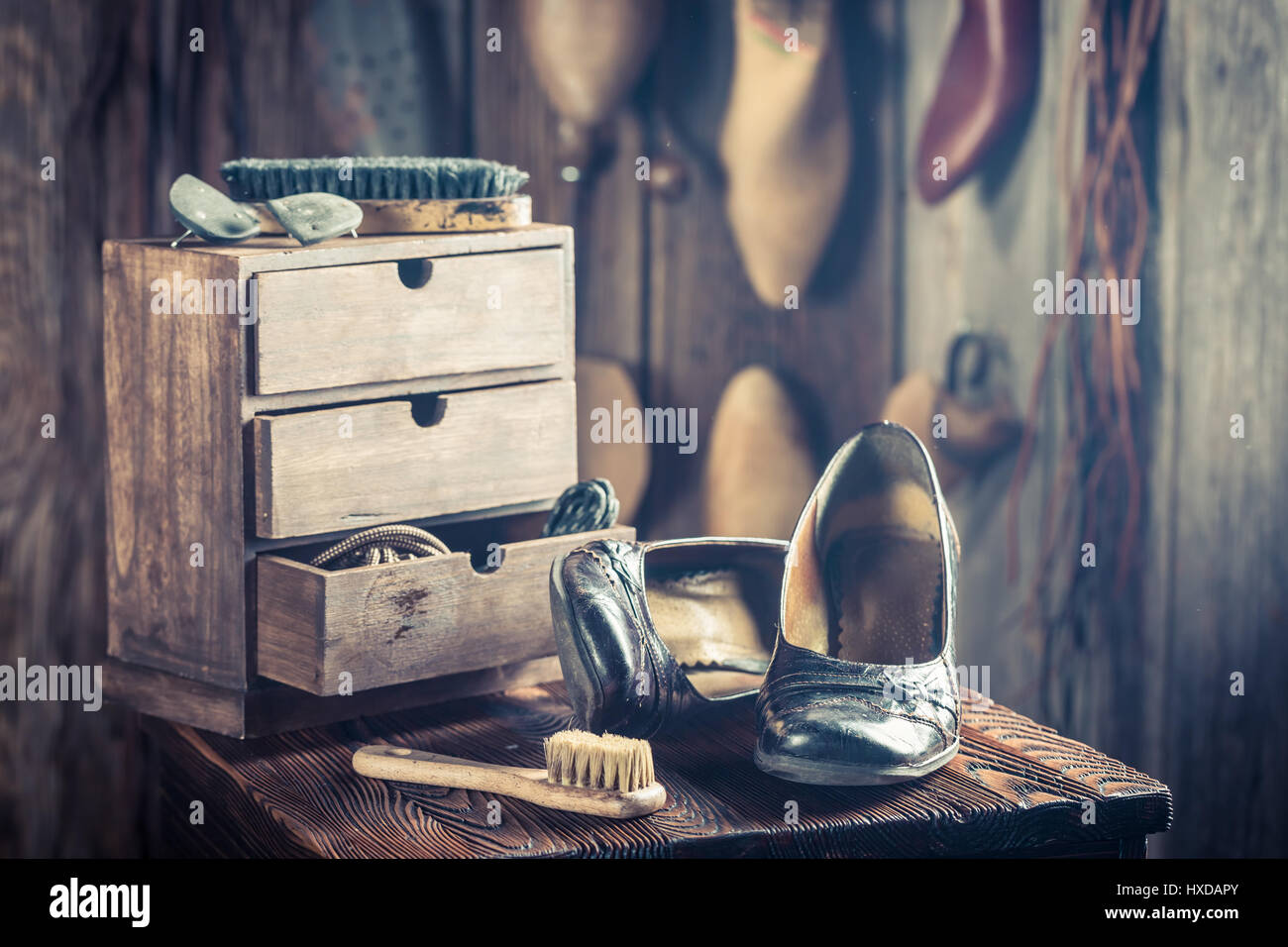 Old shoemaker workshop with tools, shoes and leather Stock Photo - Alamy