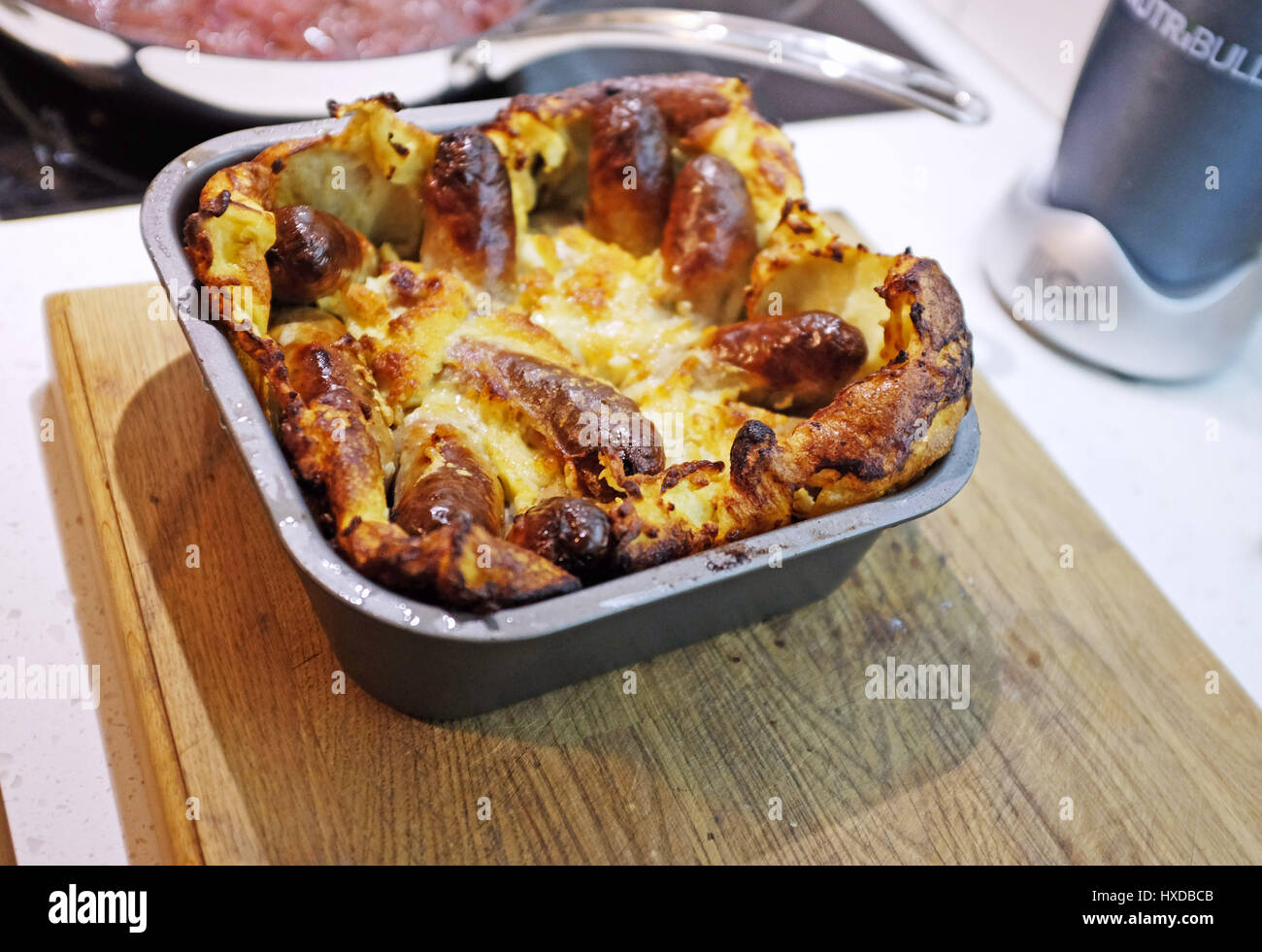 Home made Toad in the Hole sausages in batter meal Stock Photo