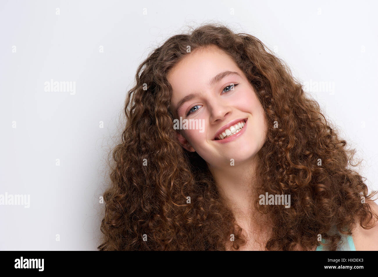 Close up portrait of a happy teenage girl smiling with curly hair Stock ...