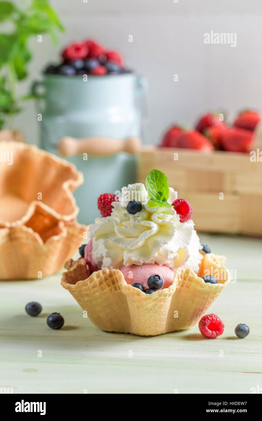 Few scoops of ice cream and berry fruits Stock Photo Alamy