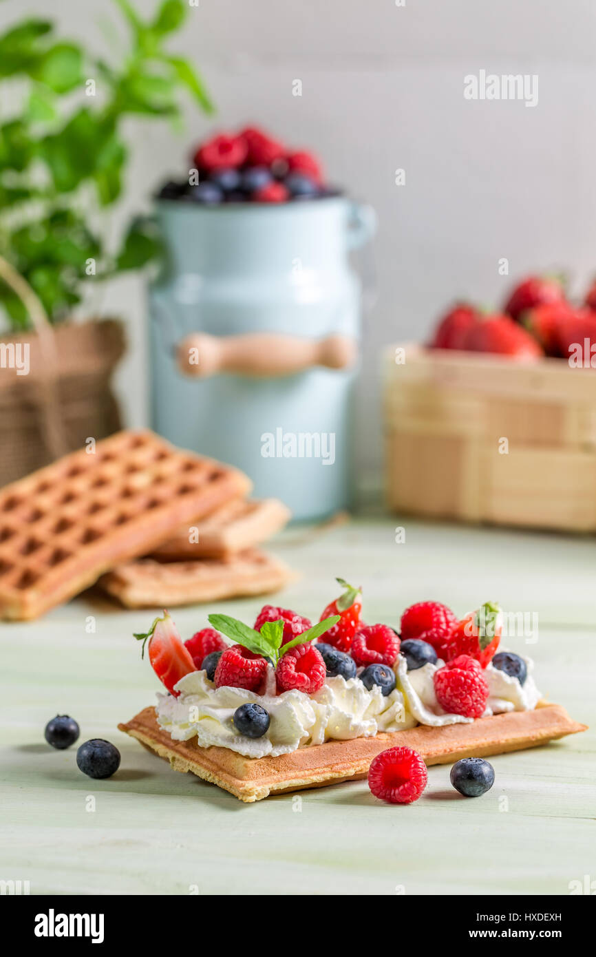 Waffle with whipped cream and fresh fruit Stock Photo - Alamy