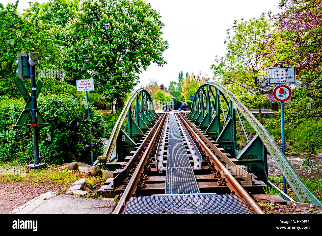 Warning at a railway bridge Stock Photo