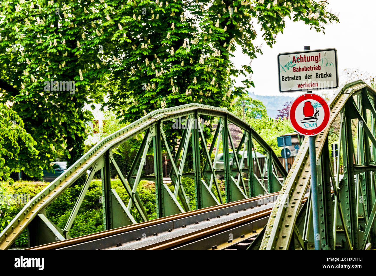 Warning at a railway bridge Stock Photo