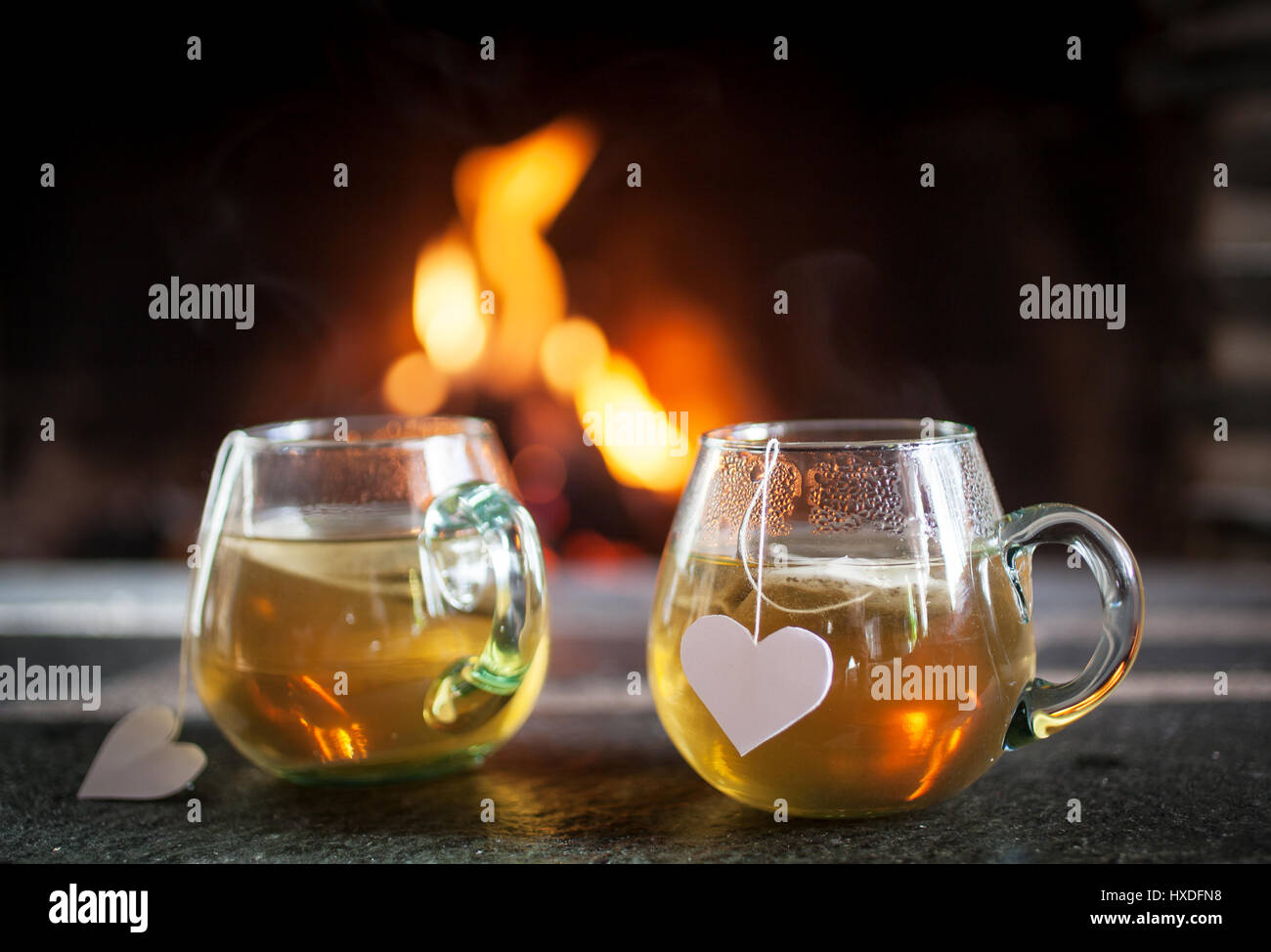 Tea for two by the fireplace Stock Photo