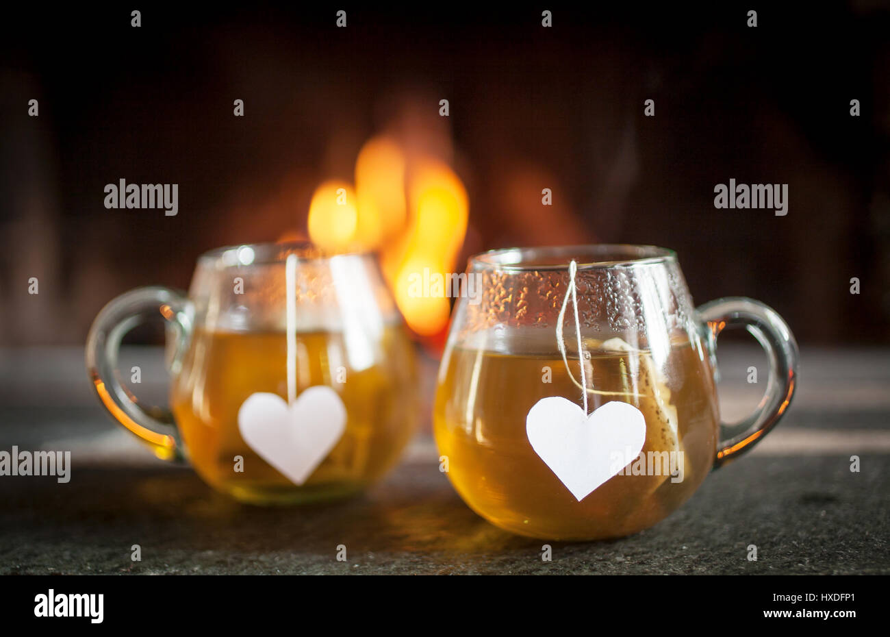 Tea for two by the fireplace Stock Photo