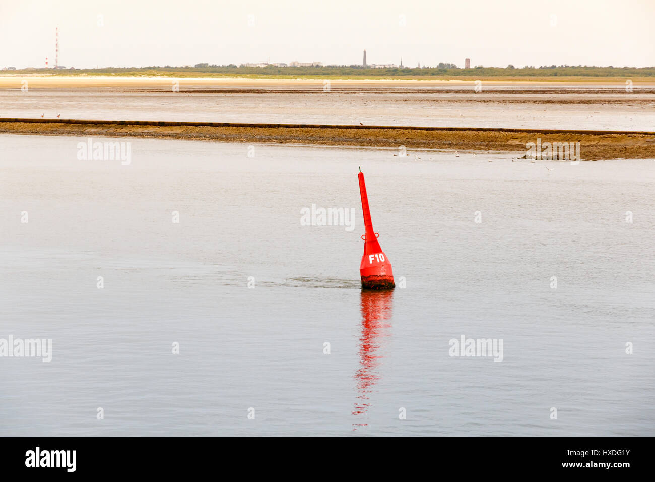 A red sea buoy off the coast of the German island of Borkum Stock Photo