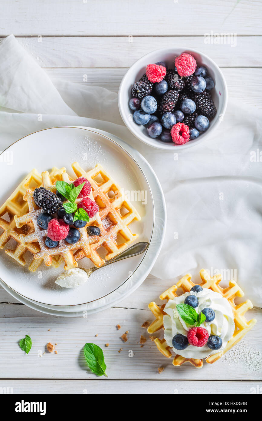 Tasty berries with waffels and whipped cream Stock Photo - Alamy
