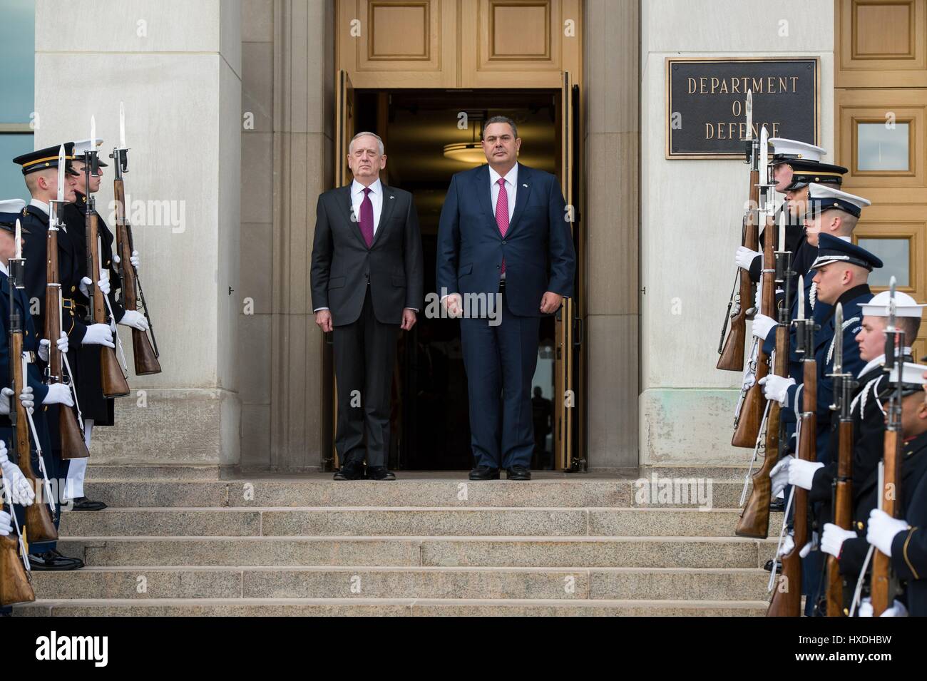U.S. Secretary of Defense Jim Mattis and Greek Defense Minister Panos Kammenos, right, during the arrival ceremony at the Pentagon March 24, 2017 in Arlington, Virginia. Stock Photo