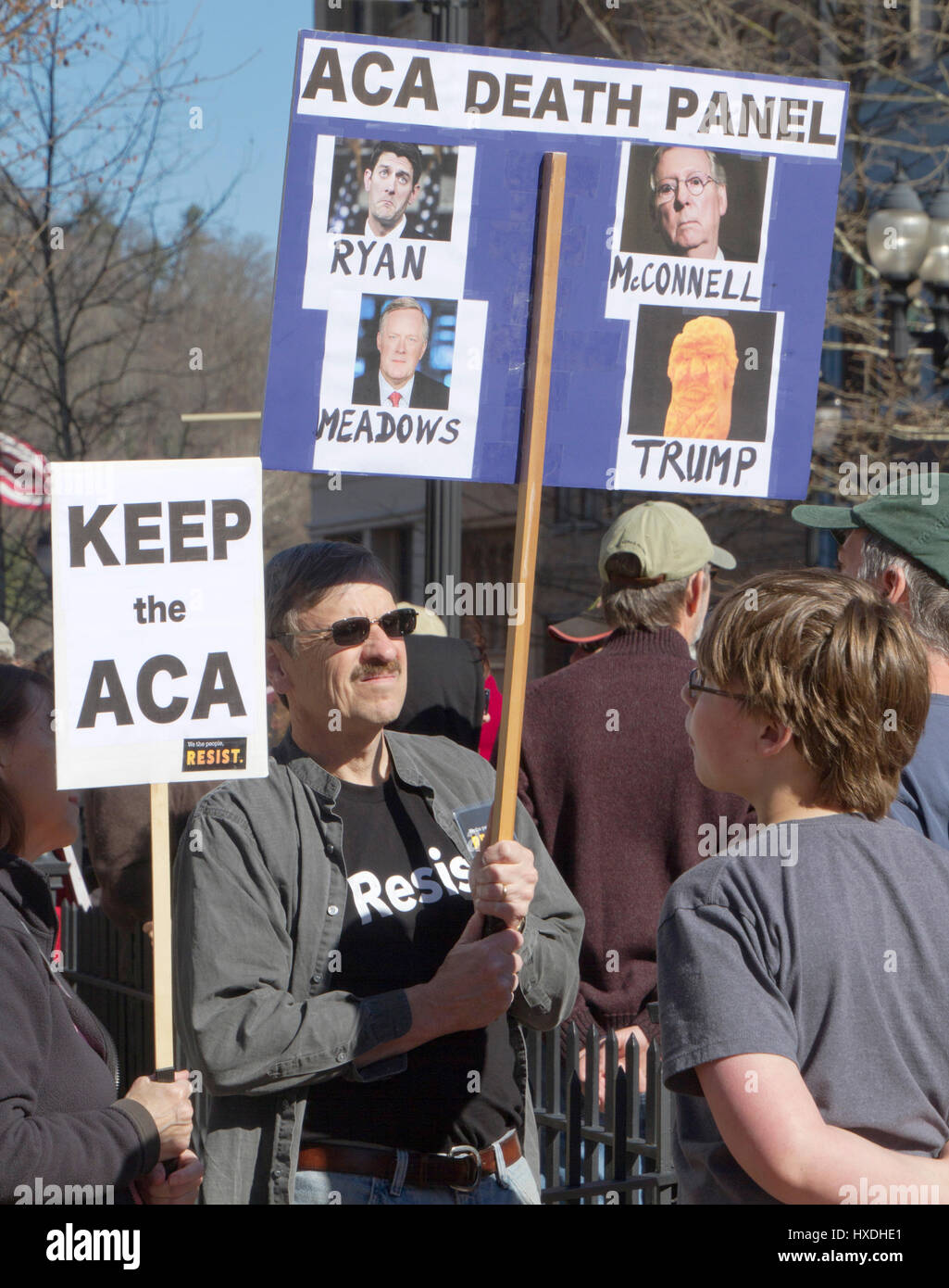 Asheville, North Carolina, USA - February 25, 2017: ACA rally signs depicting Rupublican Congressman Mark Meadows, Senators Paul Ryan, Mitch McConnell Stock Photo