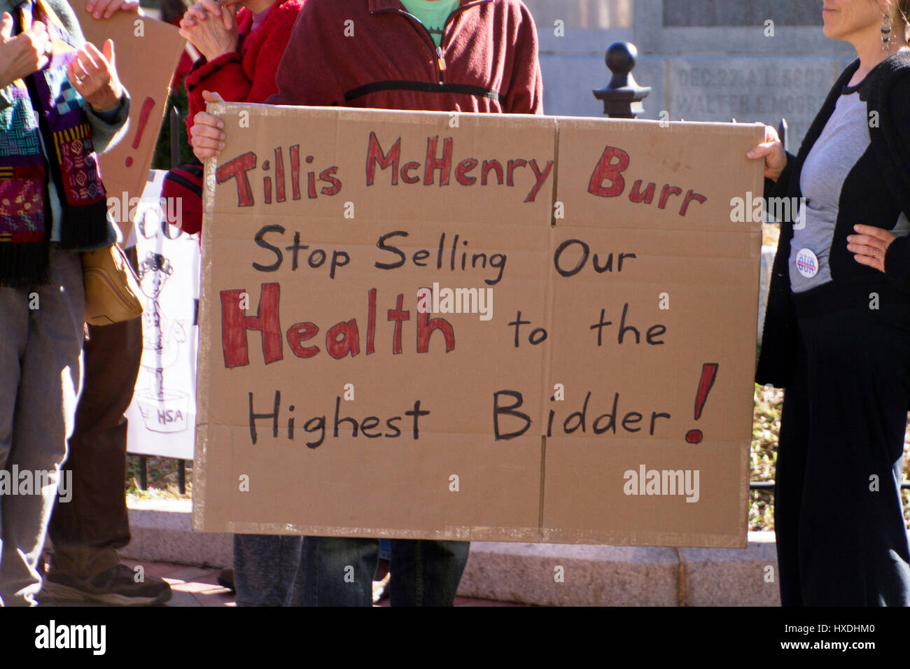 Asheville, North Carolina, USA - February 25, 2017: Senior woman holds a sign telling GOP Congressman Mark Meadows that she wants the environment, ACA Stock Photo