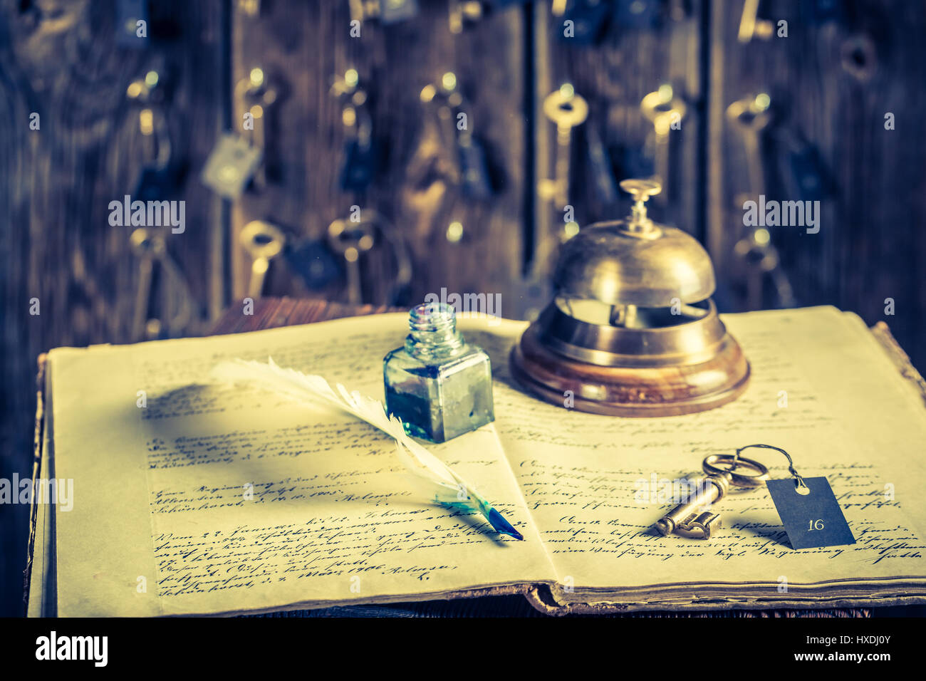 Front Desk Key Sign Guestbook and keys for rooms in vintage front desk in hotel Stock Photo ...