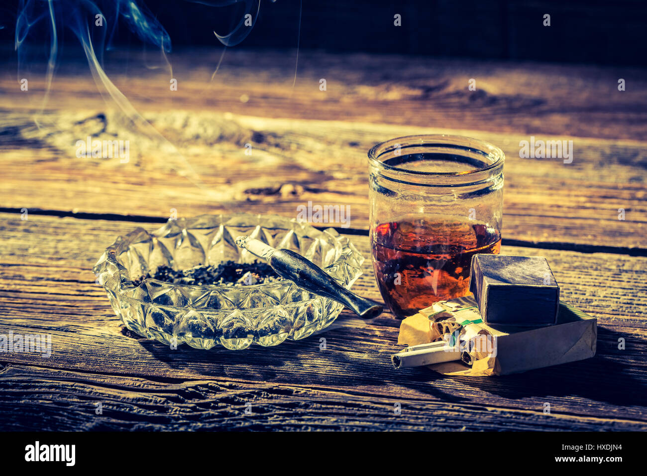 whiskey cigarettes Old whiskey, cigarettes and ashtray Stock Photo whiskey cigarettes Old whiskey, cigarettes and ashtray Stock Photo