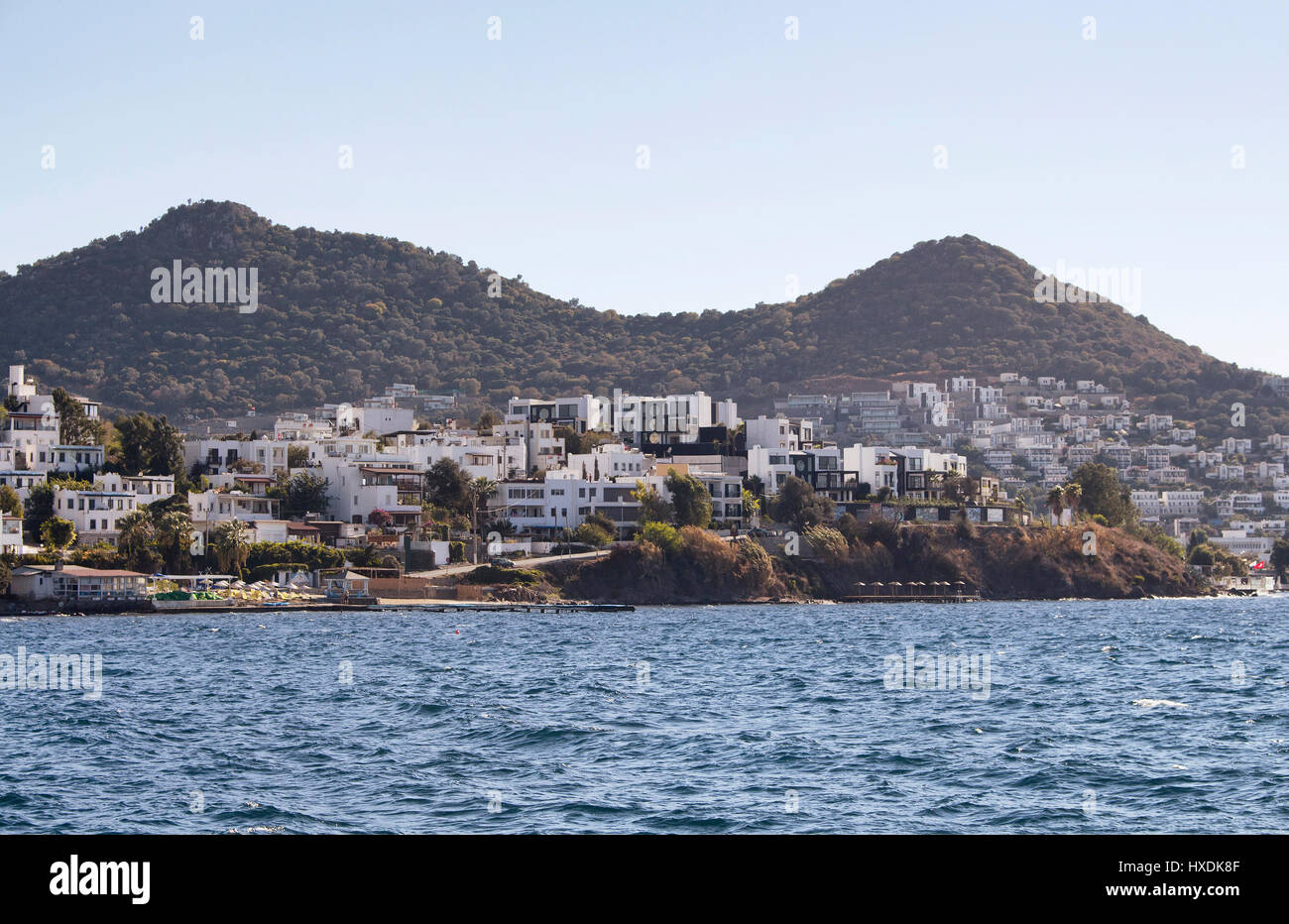 Village full of summer houses in Yalikavak area in Bodrum peninsula. Architectural style of the region is all white homes. Stock Photo