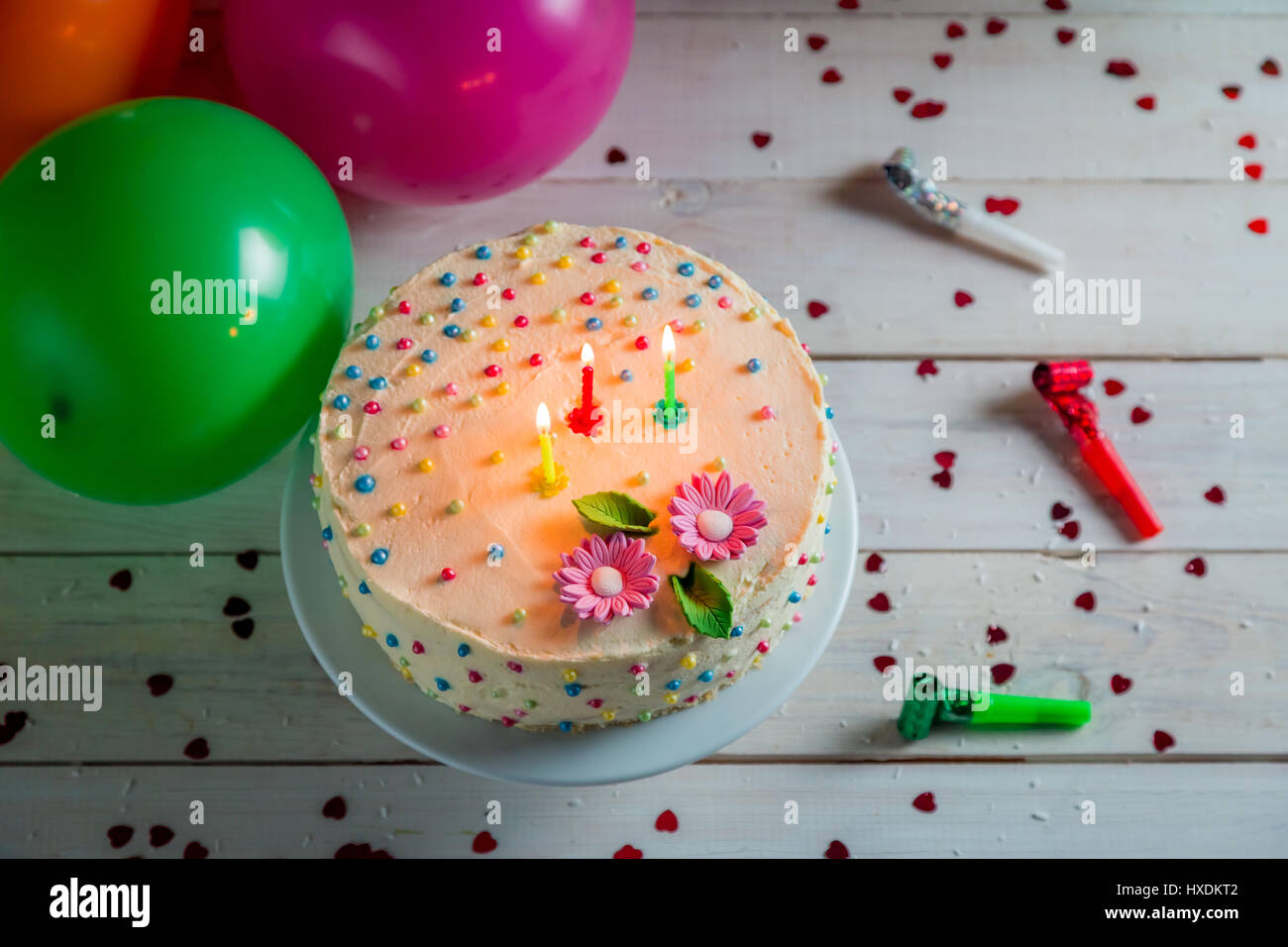 Beautifully decorated birthday cake with lighted candles Stock Photo ...