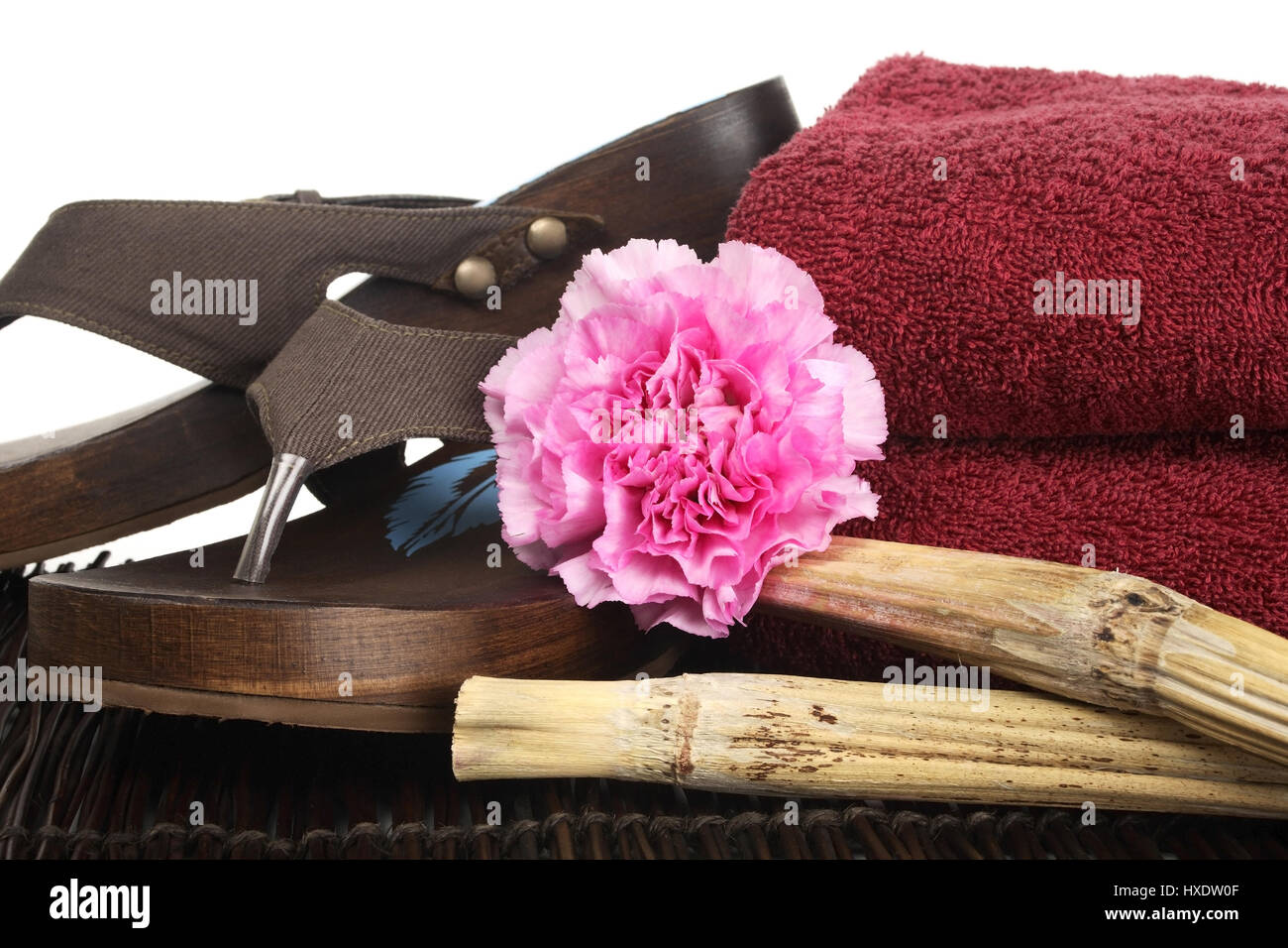 Flip flops, carnation, sugarcane and towel, Flip-Flops, Nelke, Zuckerrohr und Handtuch Stock Photo