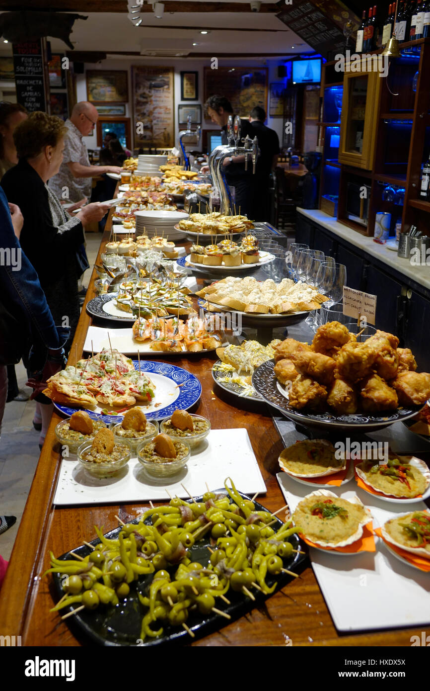 In San Sebastian, pintxos bars are vey common and offer up a variety of  snacks Stock Photo - Alamy