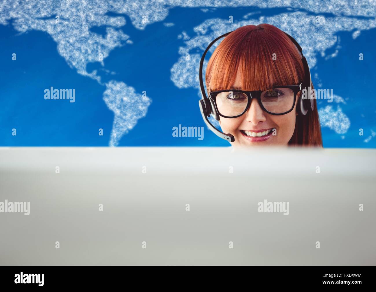 Digital composite of Travel agent behind computer against map with clouds and blue background Stock Photo