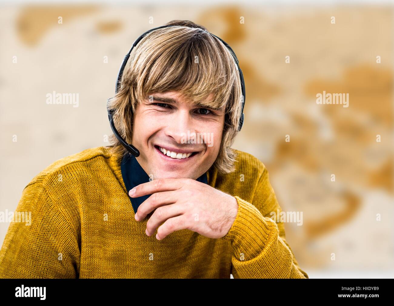 Digital composite of Travel agent in headset against brown blurry map Stock Photo