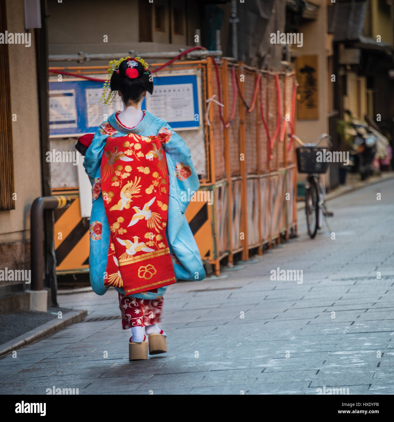Geisha walking down the street in Kyoto, Japan. Stock Photo