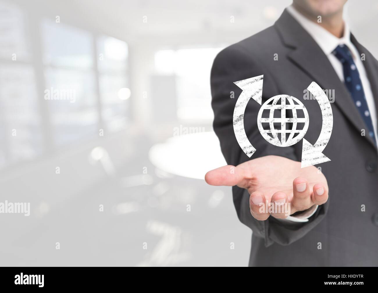 Digital composite of Open palm business hand with globe world icon and around arrows against white background Stock Photo