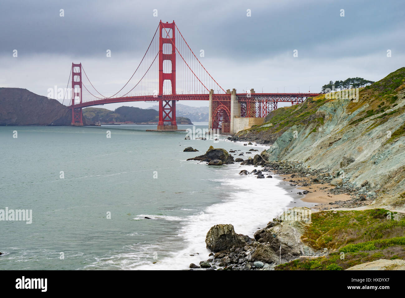 Golden Gate Bridge on a cloudy day from Baker Beach, San Francisco, California Stock Photo