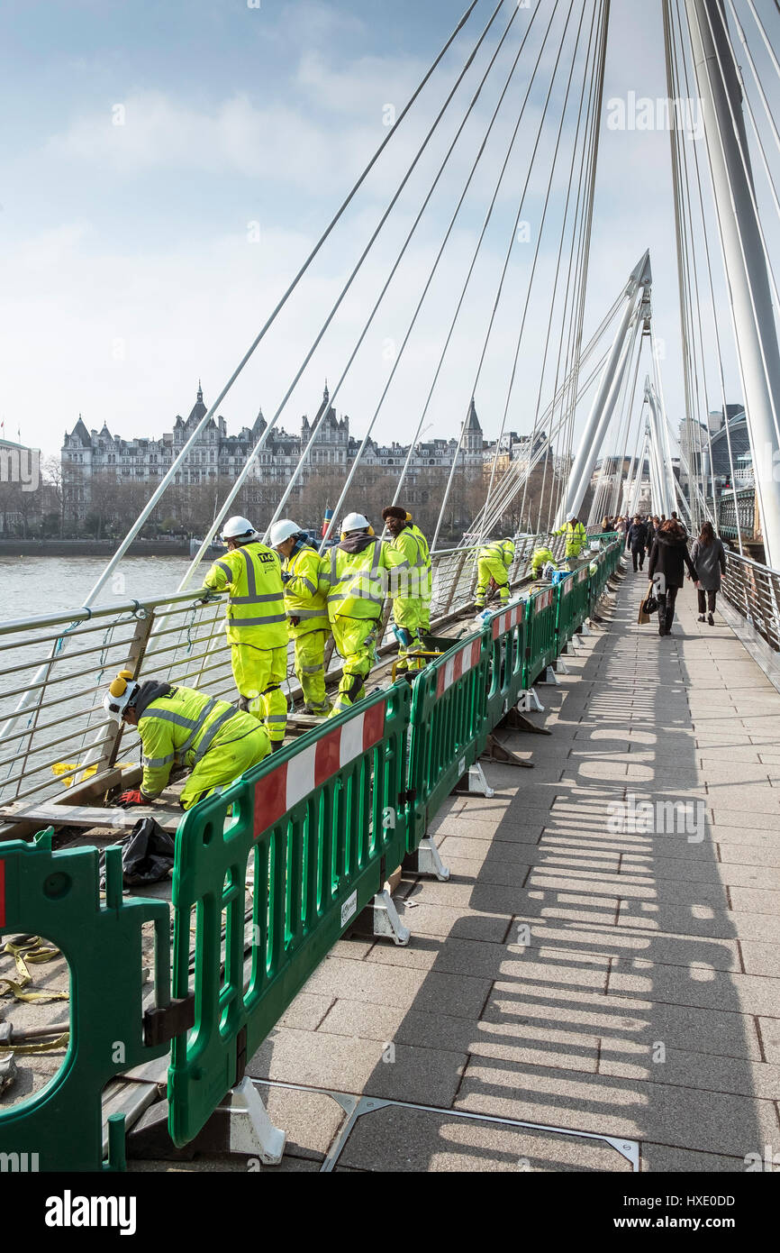 Golden Jubilee Bridge Construction Workers Working Maintenance Repairing River Thames Crossing Stock Photo