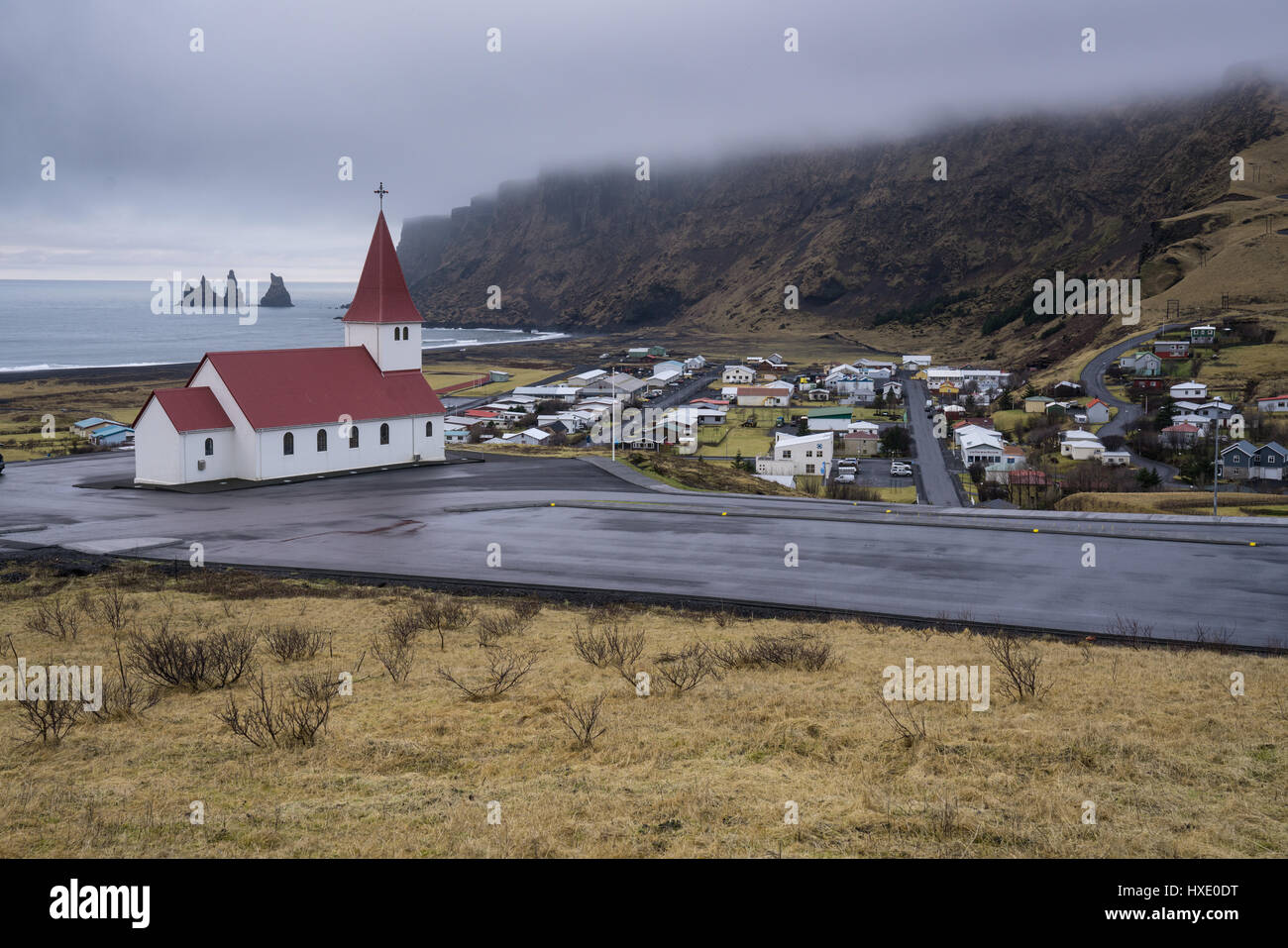 Church stands on a hill overlooking the town of Vik, Iceland along the southern coast Stock Photo