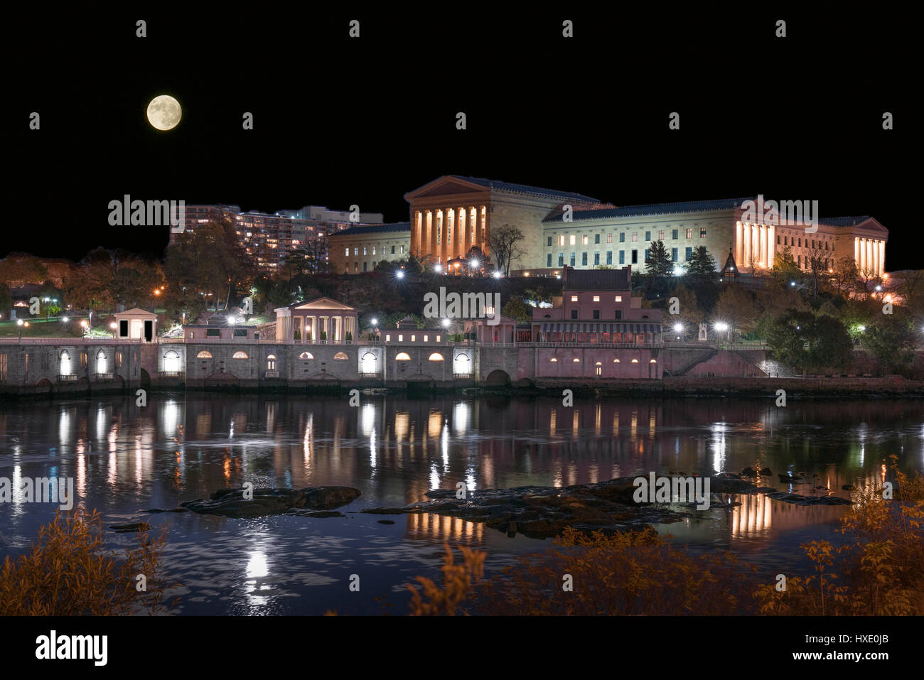 Moon over the Philadelphia Art Museum and historic Fairmount waterworks along the Schuylkill river. Stock Photo