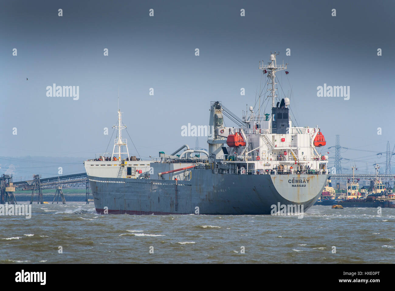 The large cement carrier Cembay steaming downriver on the River Thames in the UK. Stock Photo