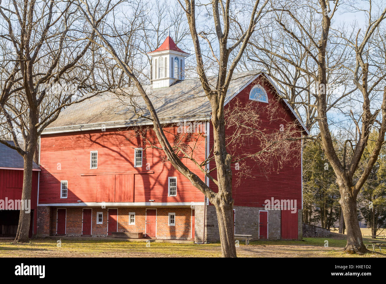 Old red barn with cupola on top Stock Photo