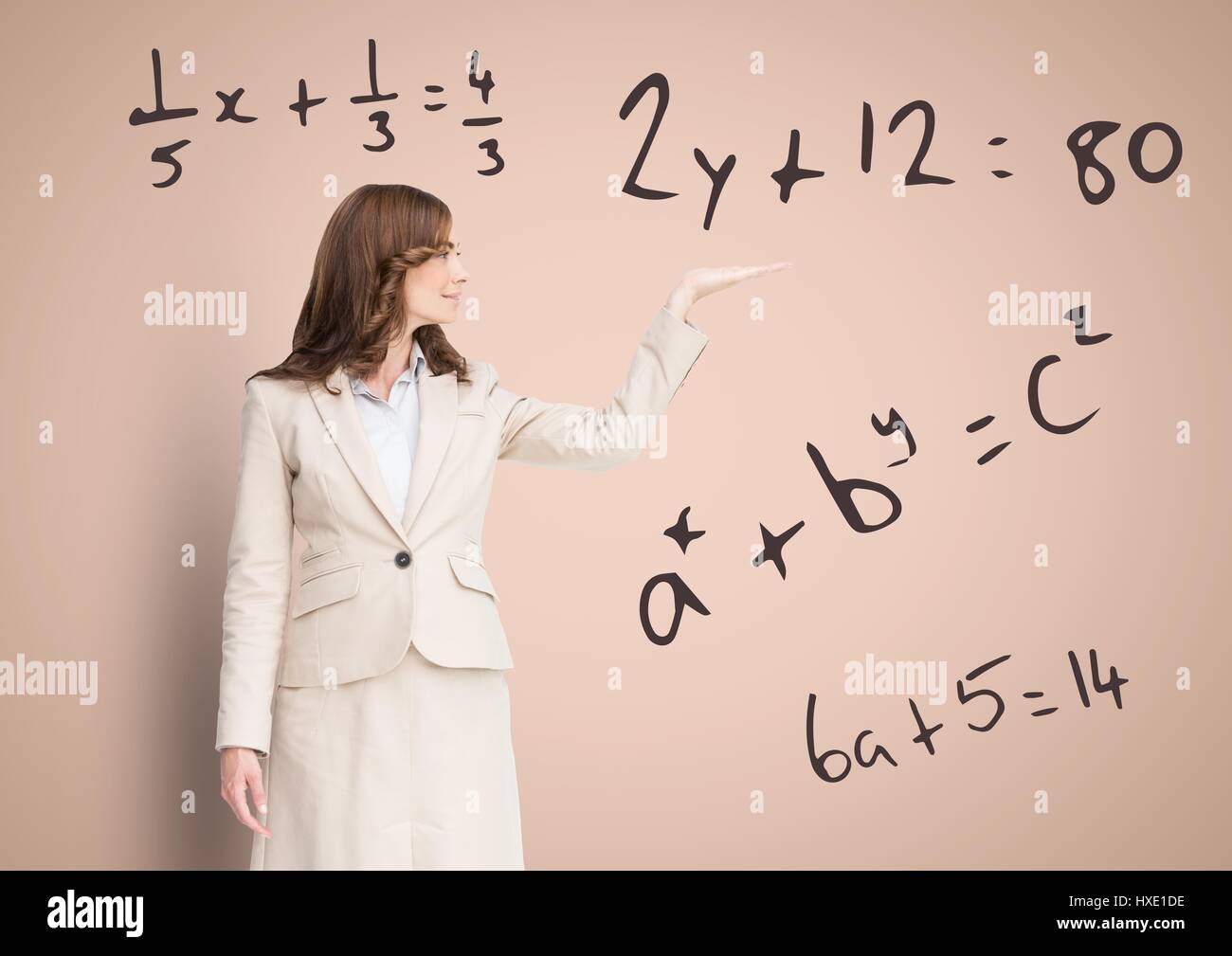 Digital composite of Woman with open palm hand with math equations ...