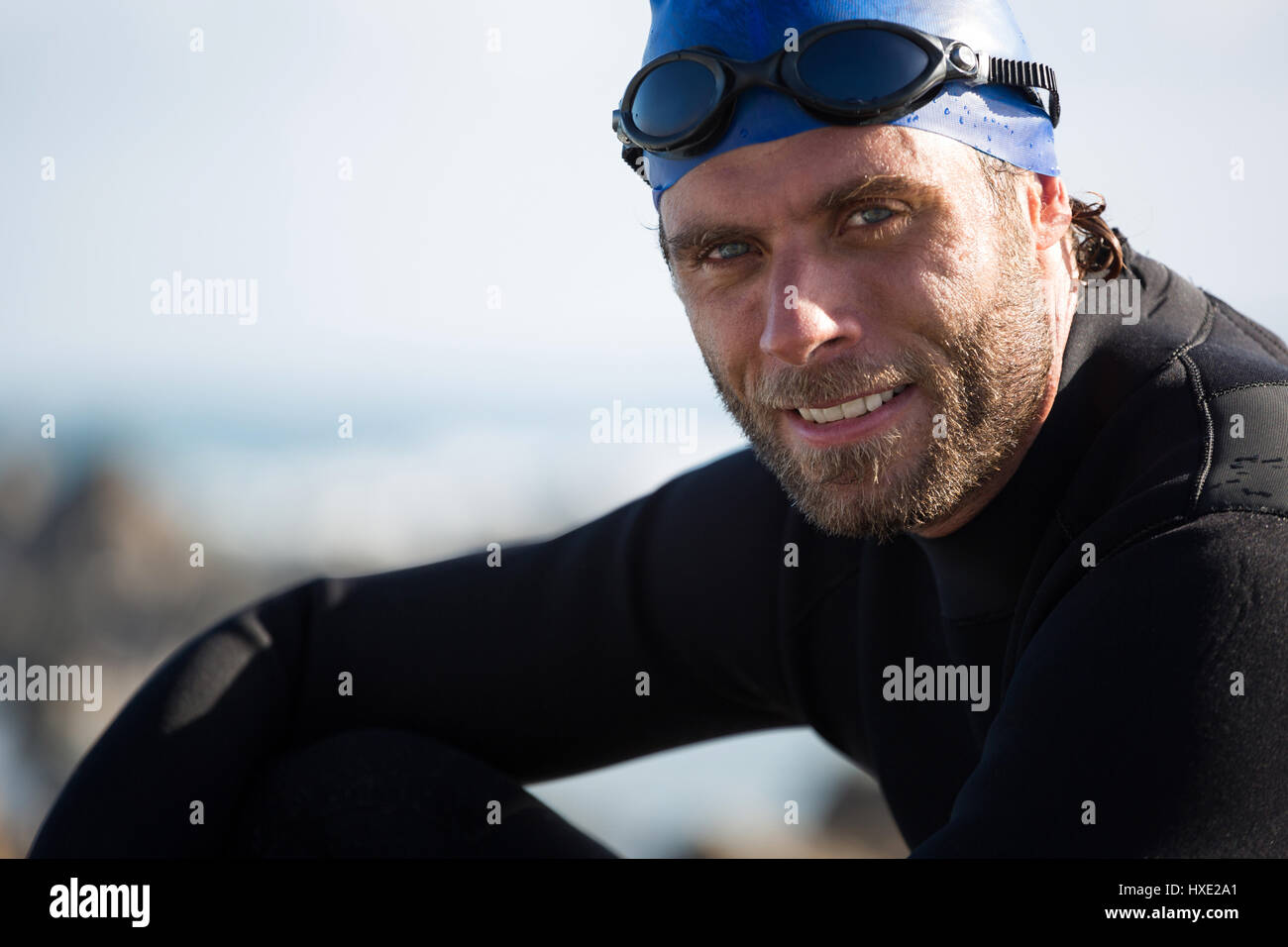 Portrait of confident sportsman on sunny day Stock Photo