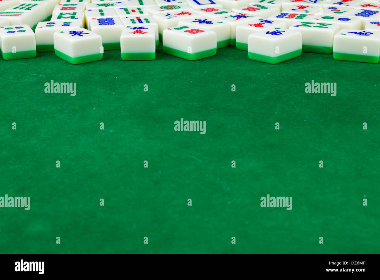 Mahjong Tabletop With Many Mahjong Tiles Lay Randomly in the Back Stock Photo
