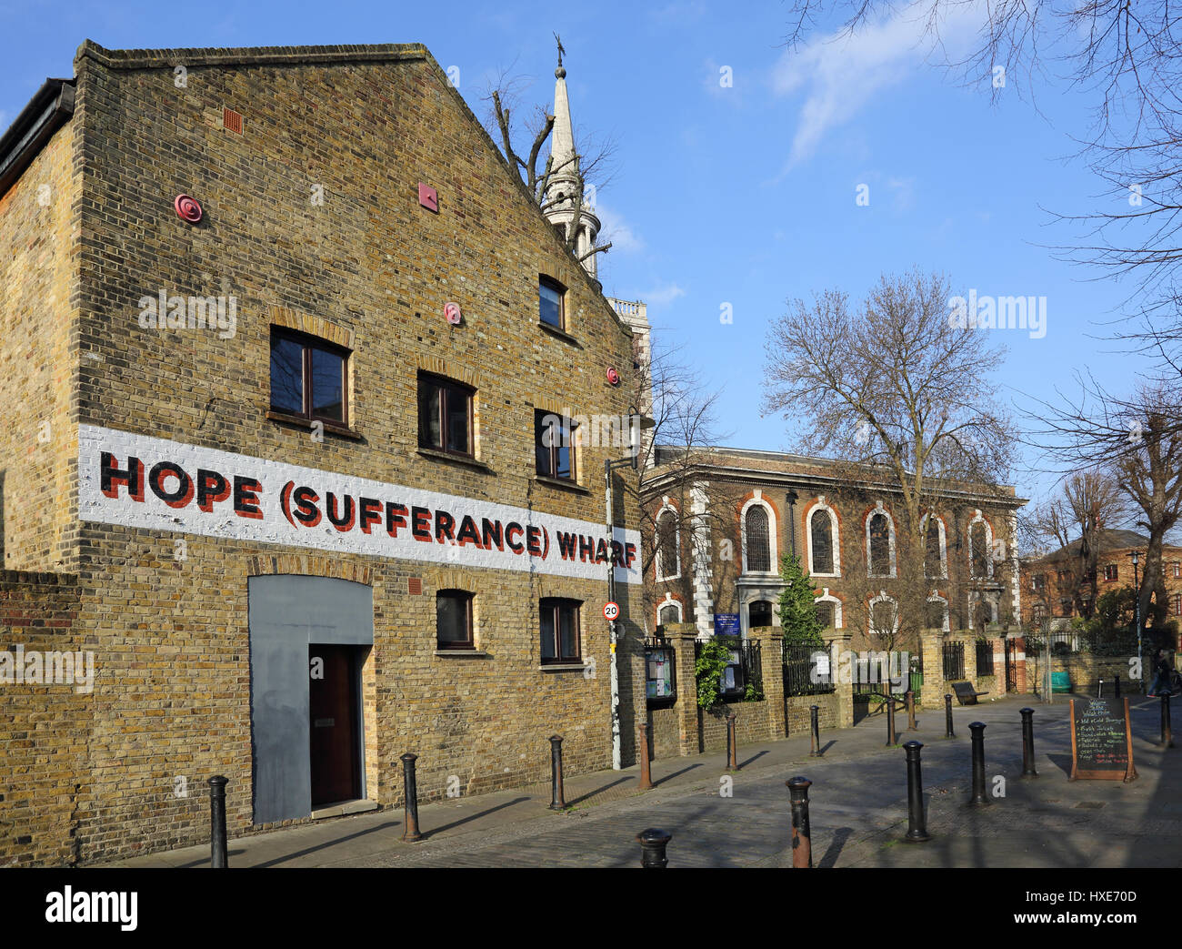 Hope Sufferance Wharf. Refurbished Victorian warehouses in Rotherhithe, East London, UK. Next to the church of St Mary the Stock Photo