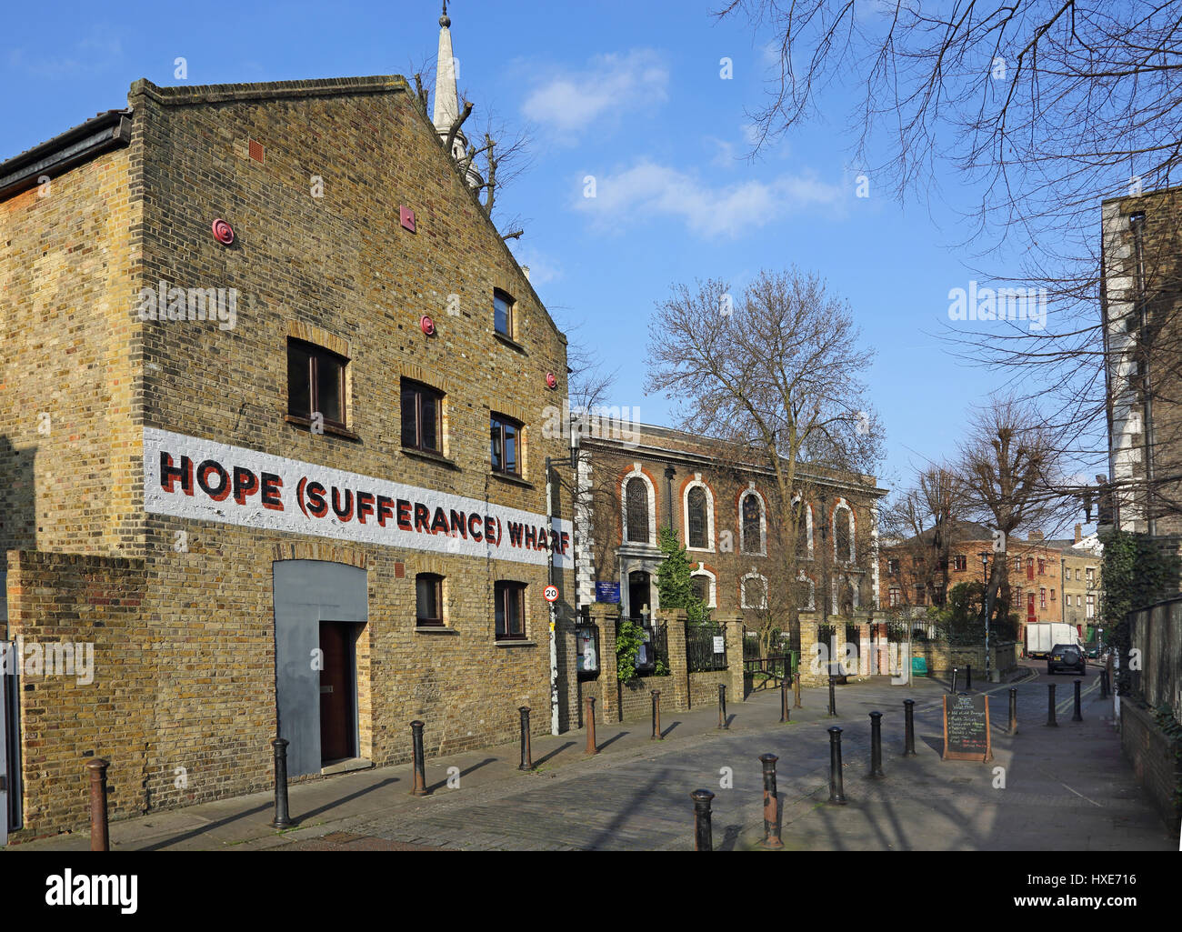 Hope Sufferance Wharf. Refurbished Victorian warehouses in Rotherhithe, East London, UK. Next to the church of St Mary the Virgin. Stock Photo