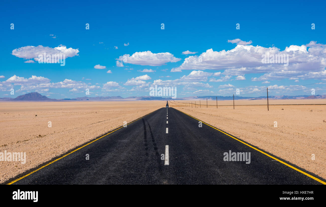 vibrant image of highway and blue cloudy sky Stock Photo - Alamy