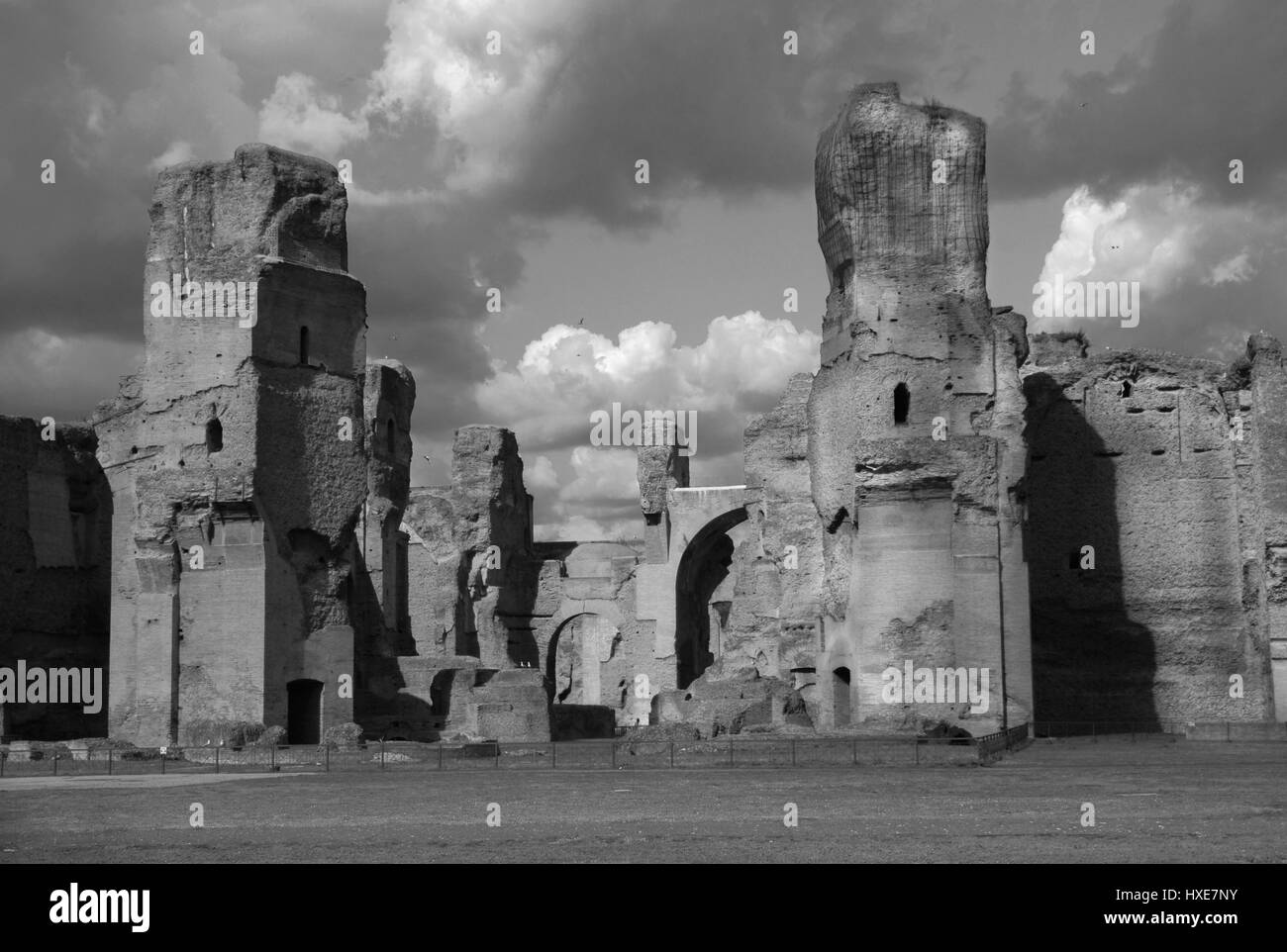 Ancient Baths of Caracalla ruins in the historic center of Rome with beautiful clouds (Black and White) Stock Photo