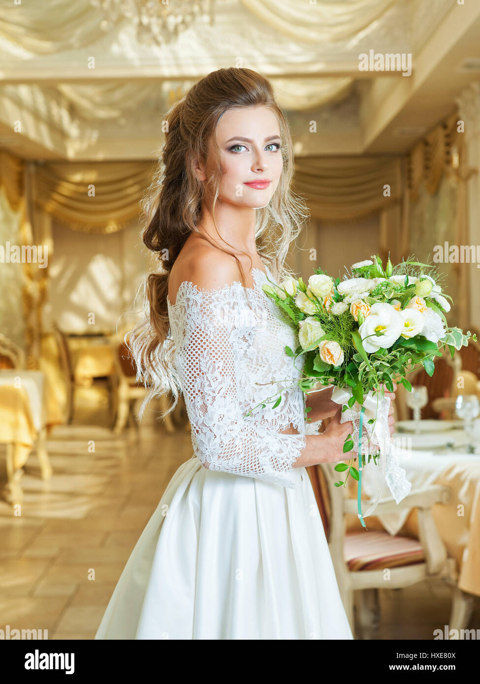 Beautiful blonde bride in a wedding dress Stock Photo - Alamy