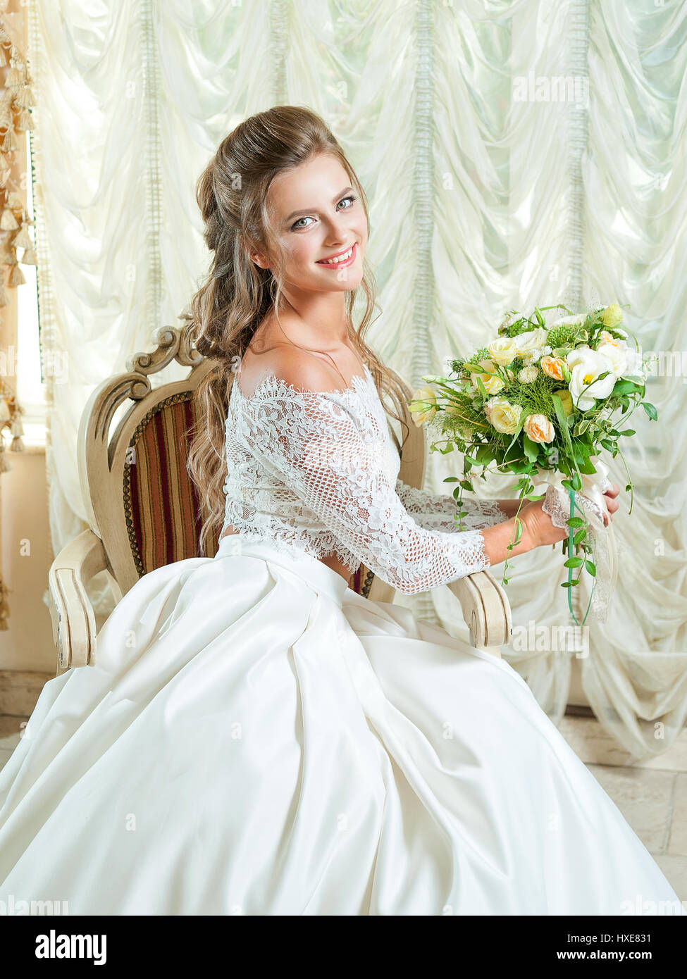Beautiful blonde bride in a wedding dress Stock Photo - Alamy