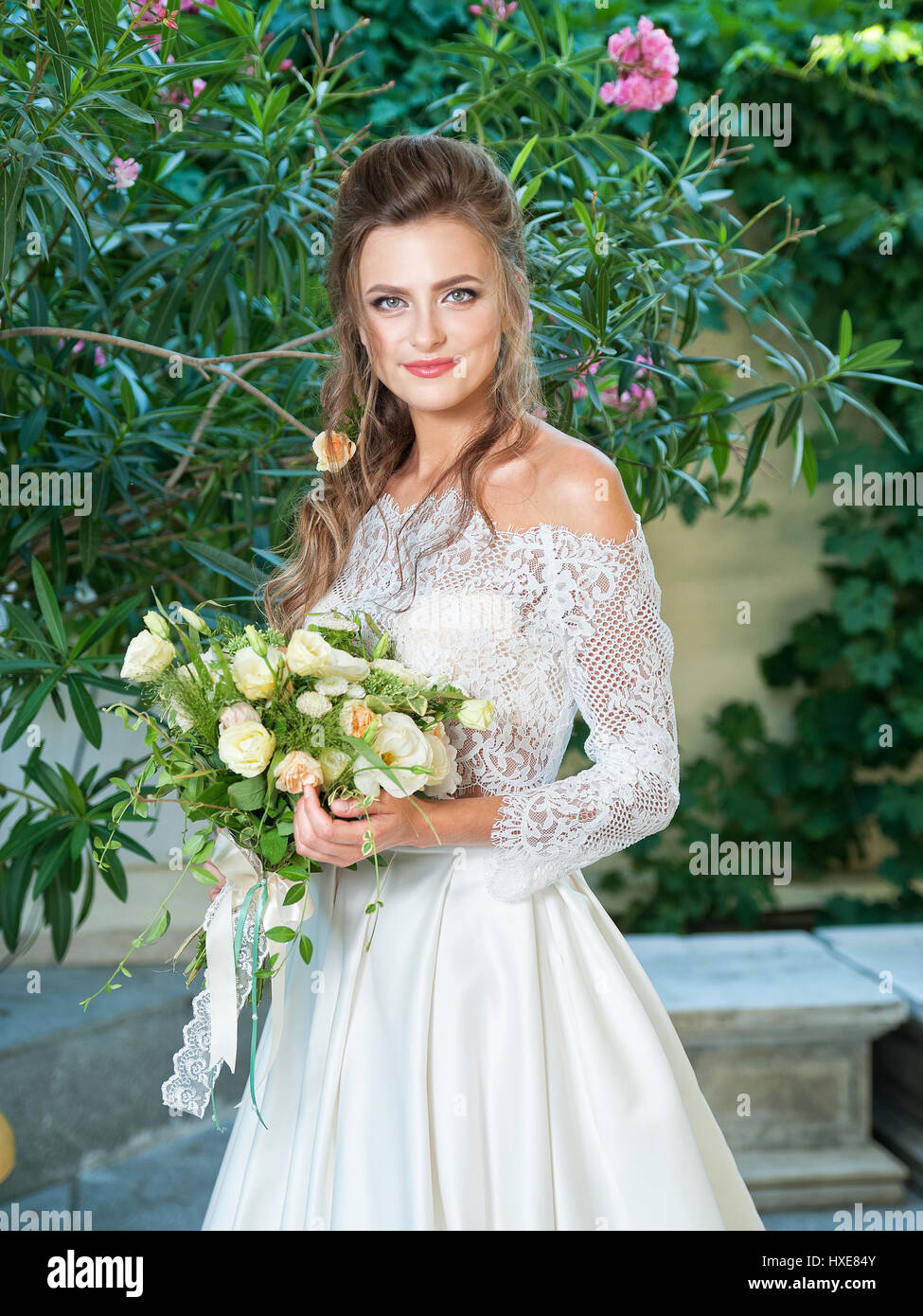 Beautiful blonde bride in a wedding dress Stock Photo - Alamy