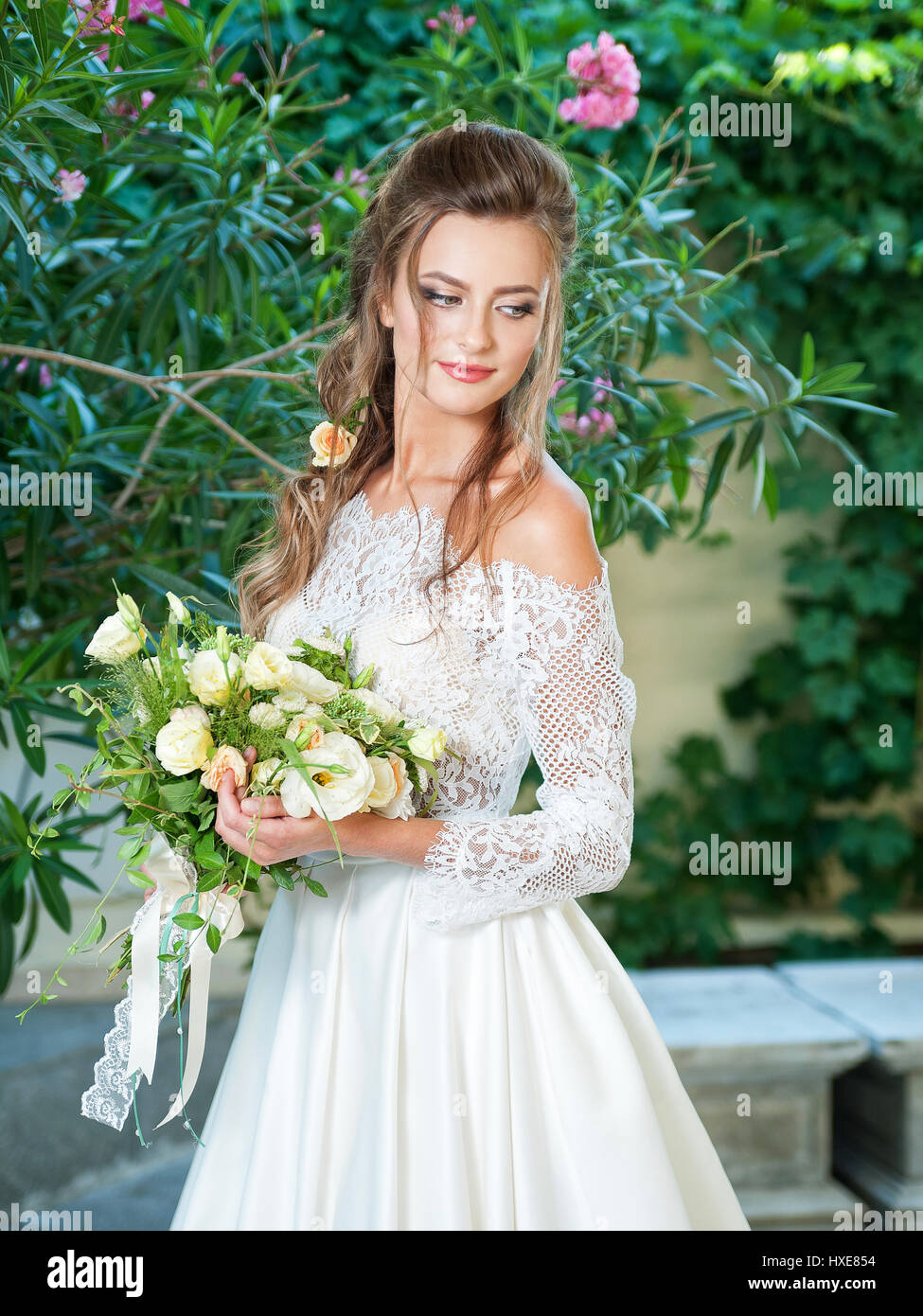 Beautiful blonde bride in a wedding dress Stock Photo - Alamy