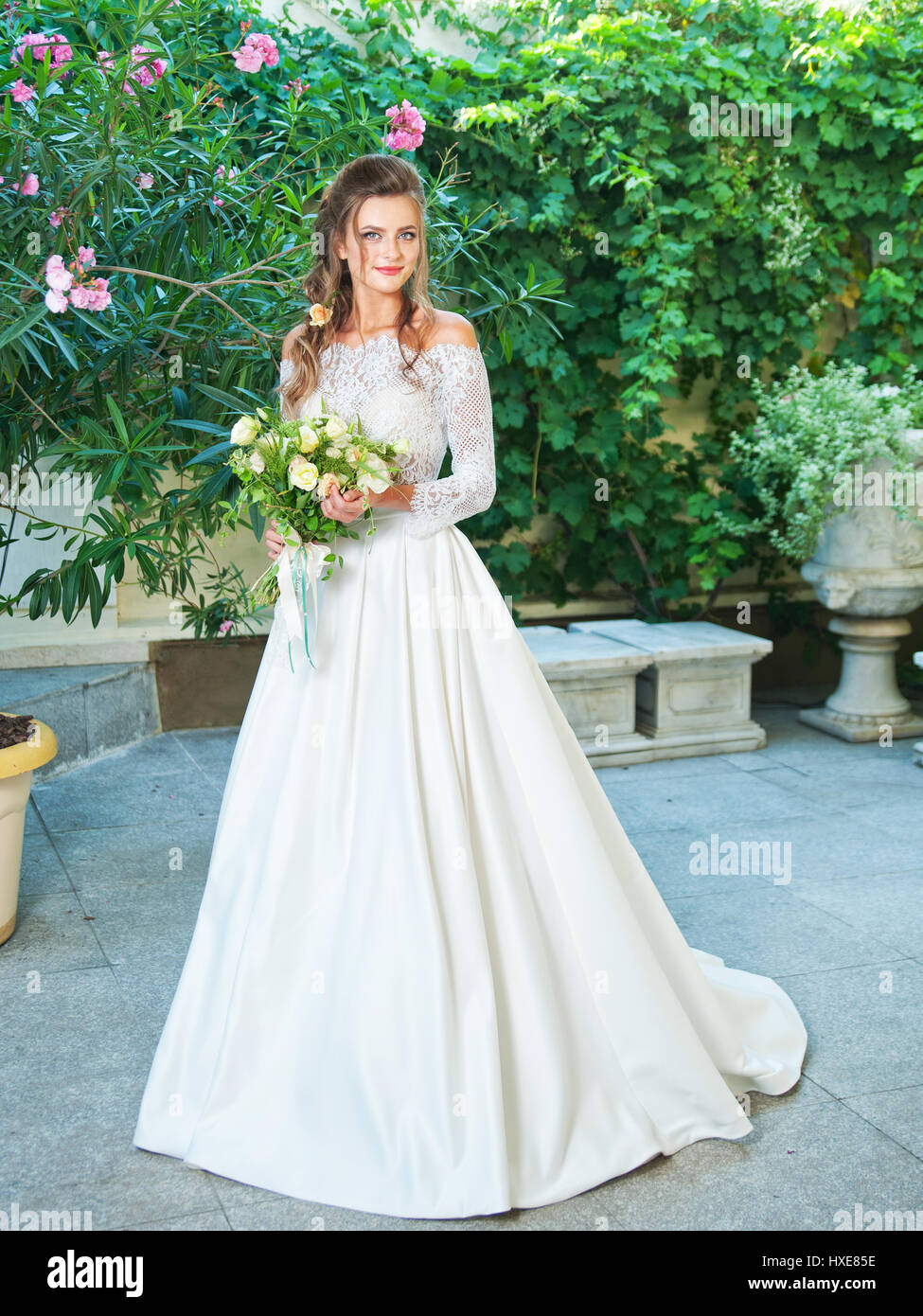 Beautiful blonde bride in a wedding dress Stock Photo - Alamy