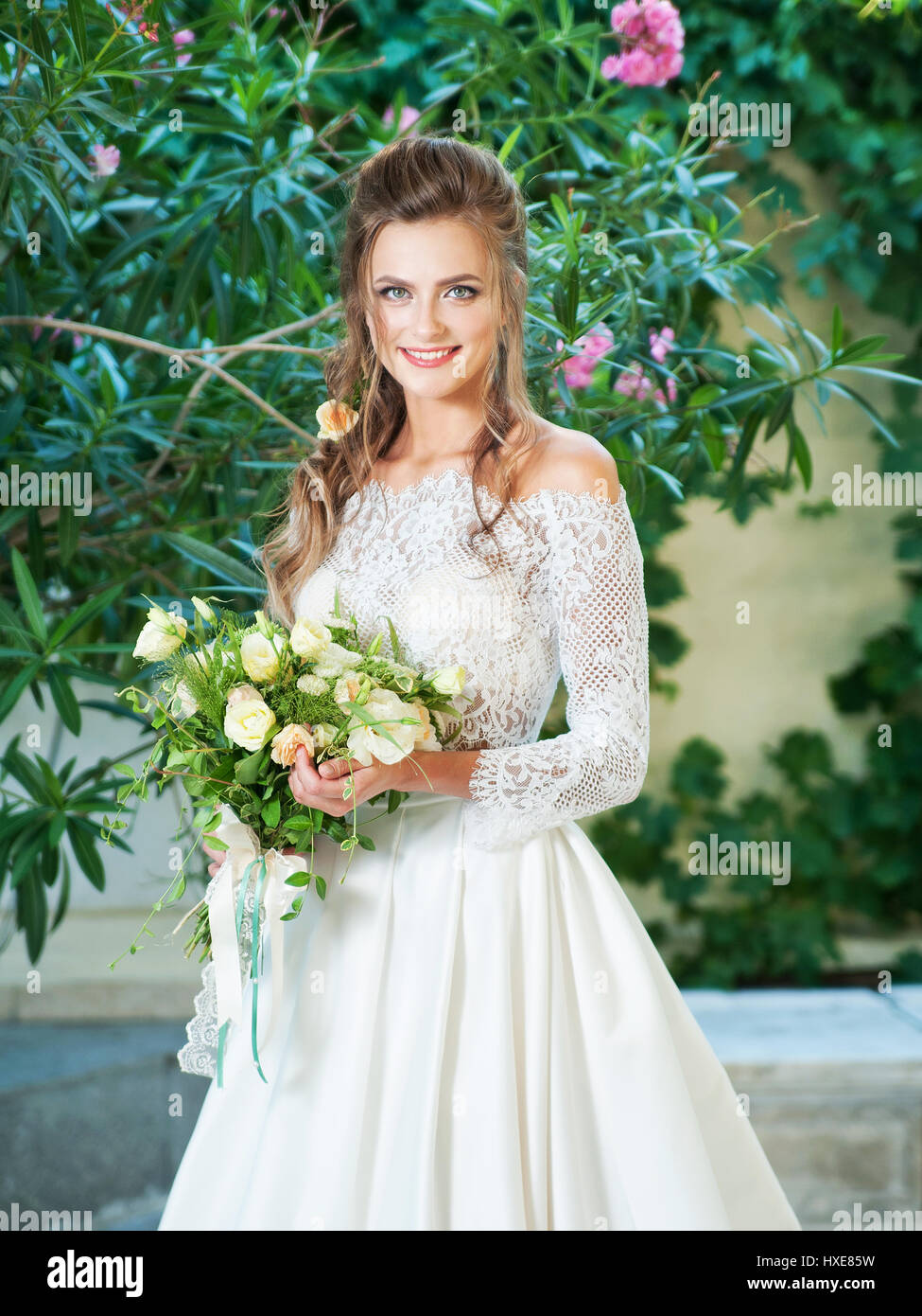 Beautiful blonde bride in a wedding dress Stock Photo - Alamy