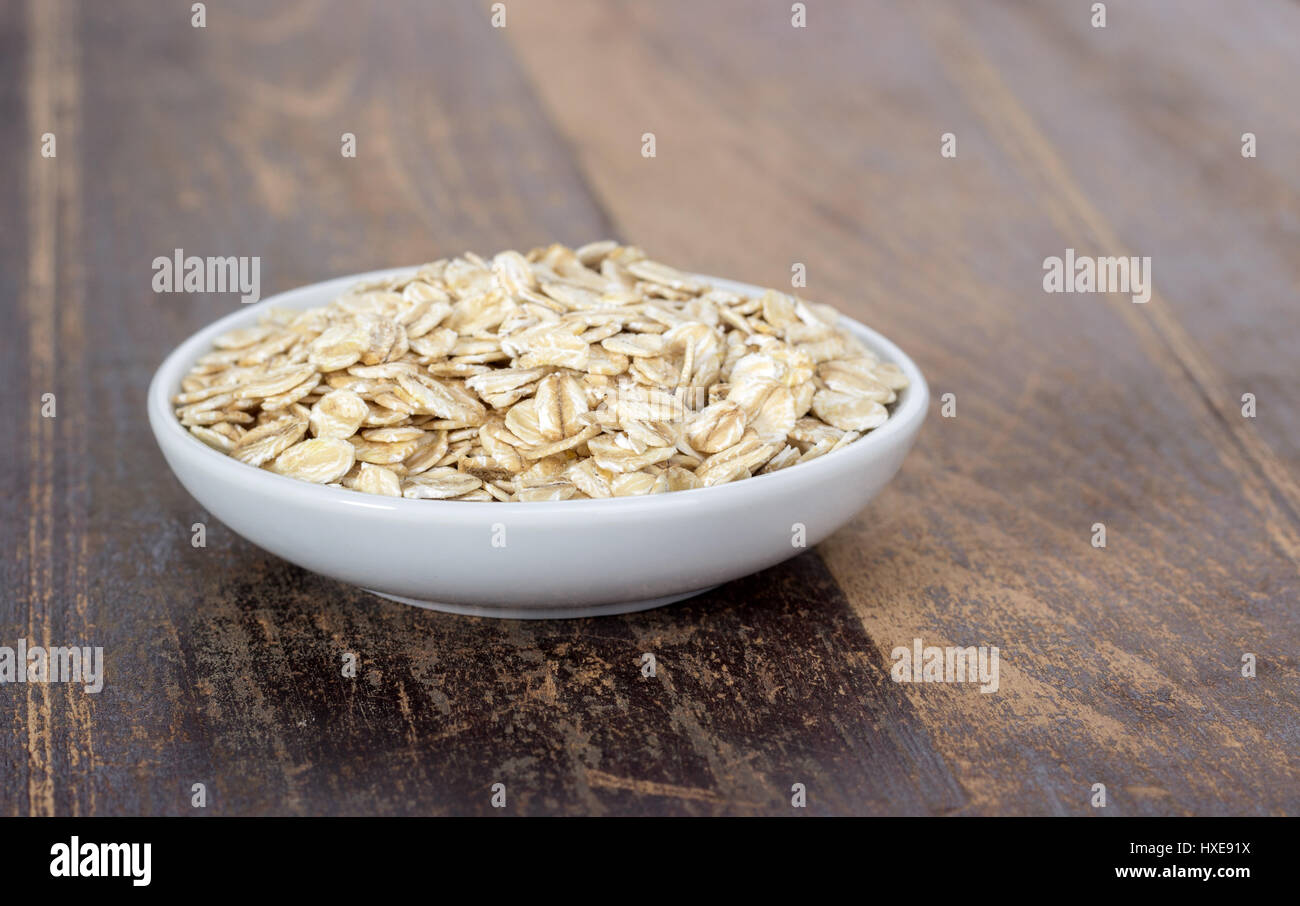 Porcelain bowl with oatmeal Stock Photo