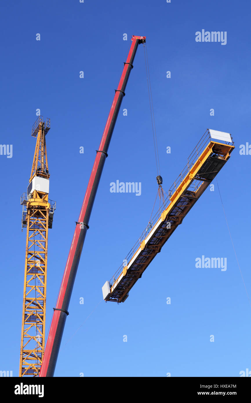 Crane erection process, setting up a tower crane. Tower Mast Is Being
