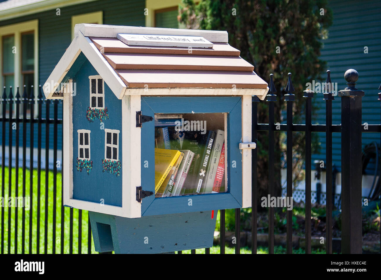 March, 2017, Houston, Texas: A Little Free Library  promoting 'take a book, leave a book' located in the historic Houston Heights Stock Photo