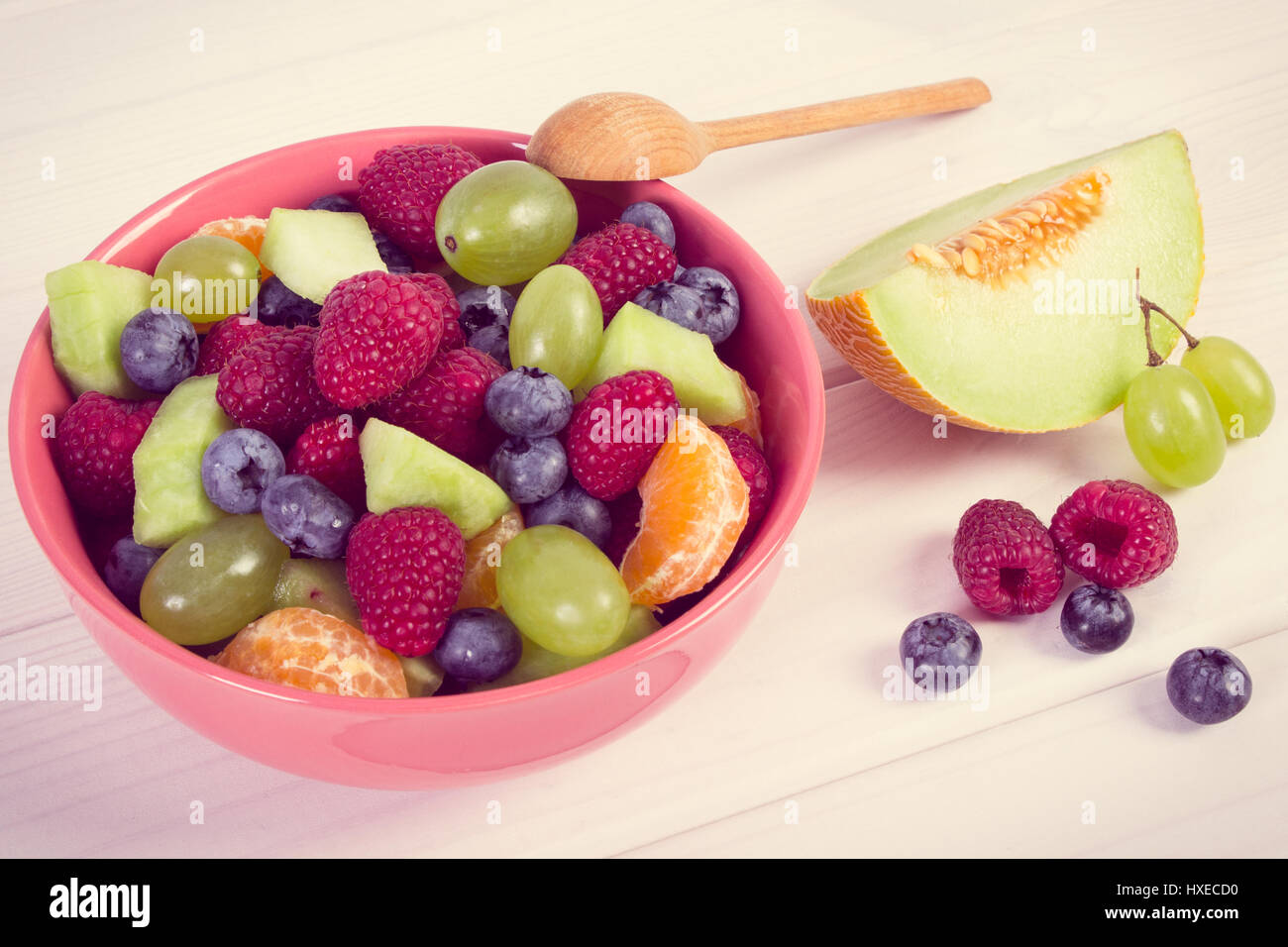 Raspberry Melon Vintage photo, Fresh fruit salad with raspberries, melon, mandarine ...